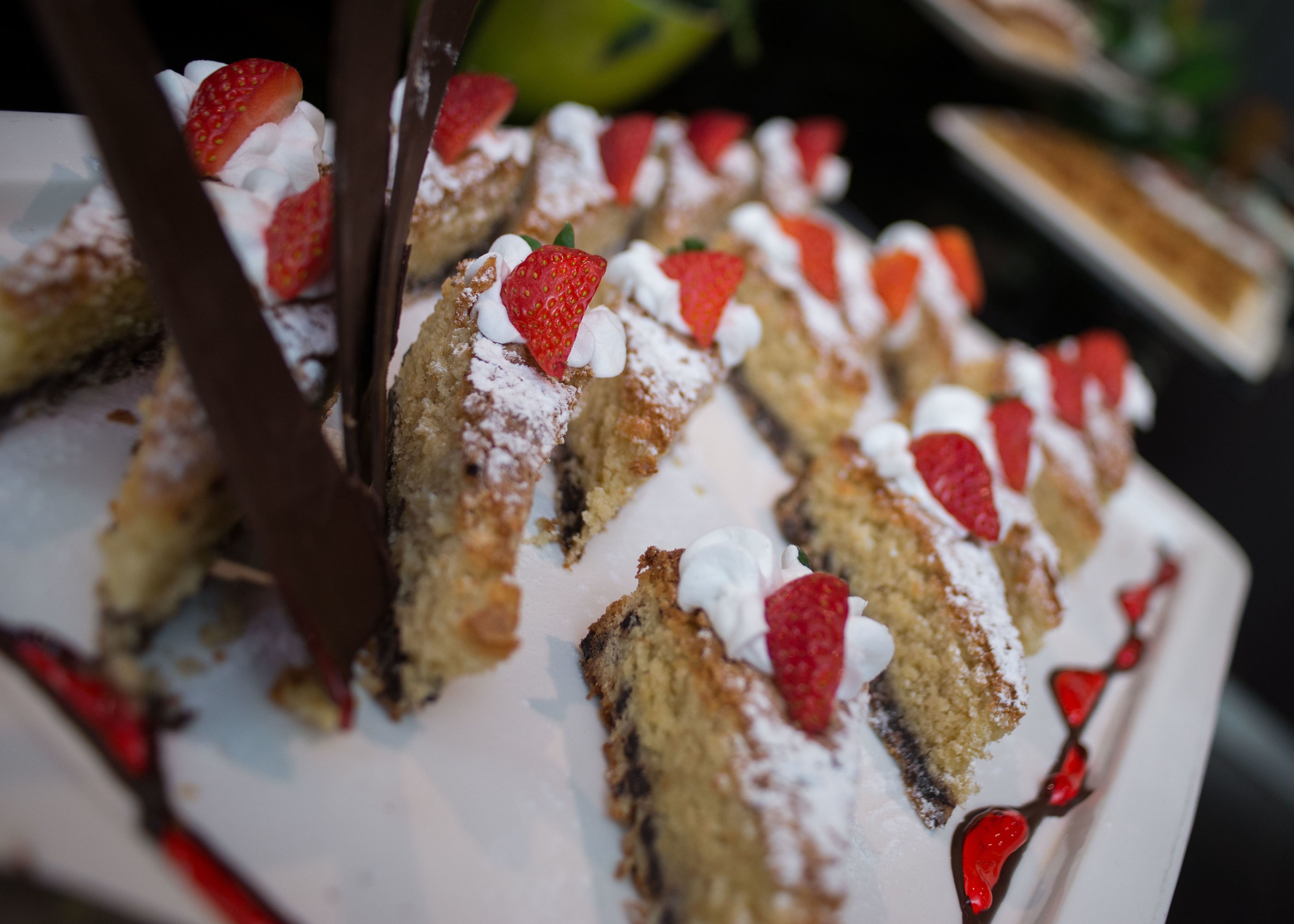 A dessert with strawberries and whipped cream.