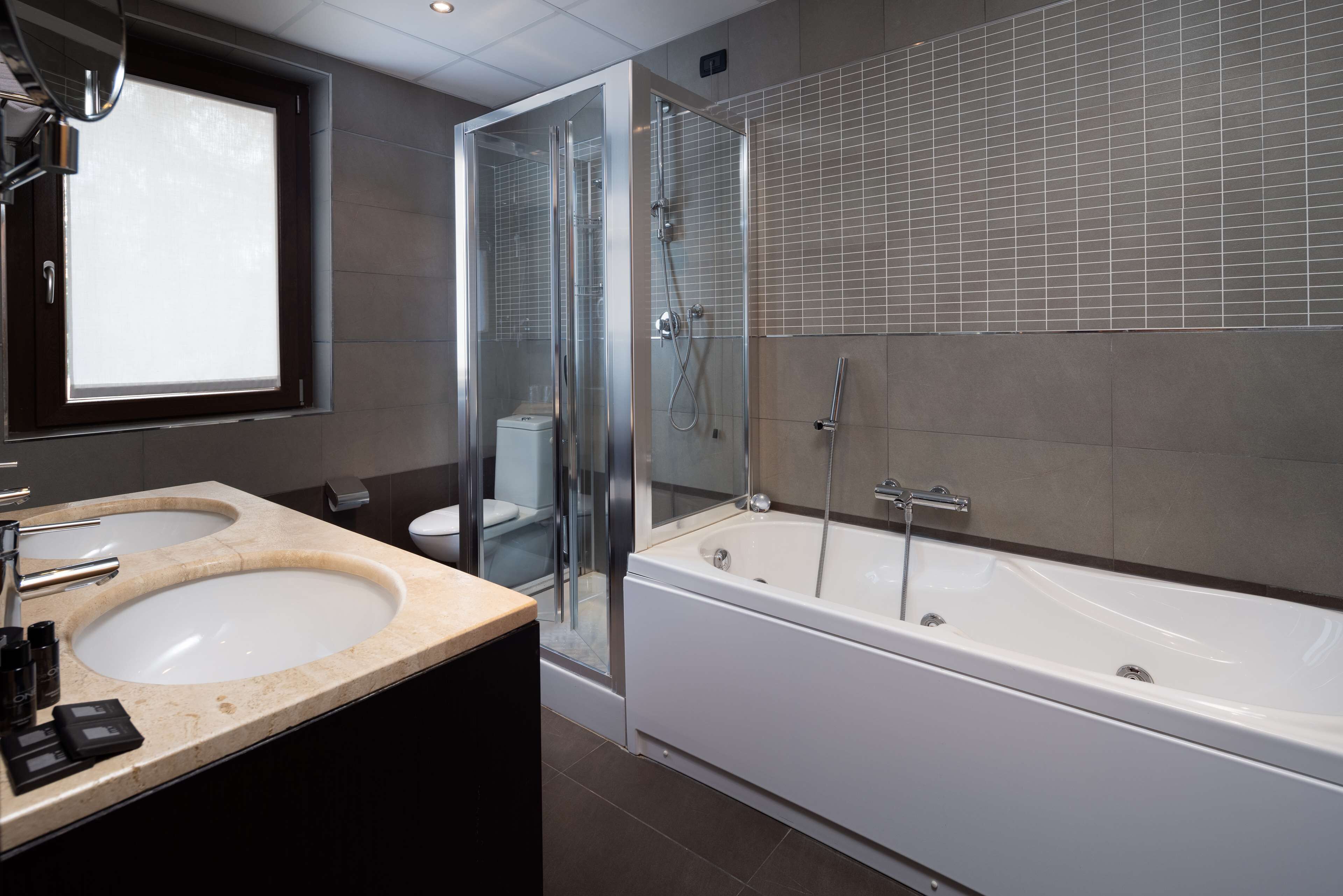junior suite, 1 king bed (second and third bed is a sofabed) | bathroom | combined shower/bathtub, free toiletries, hair dryer, bidet