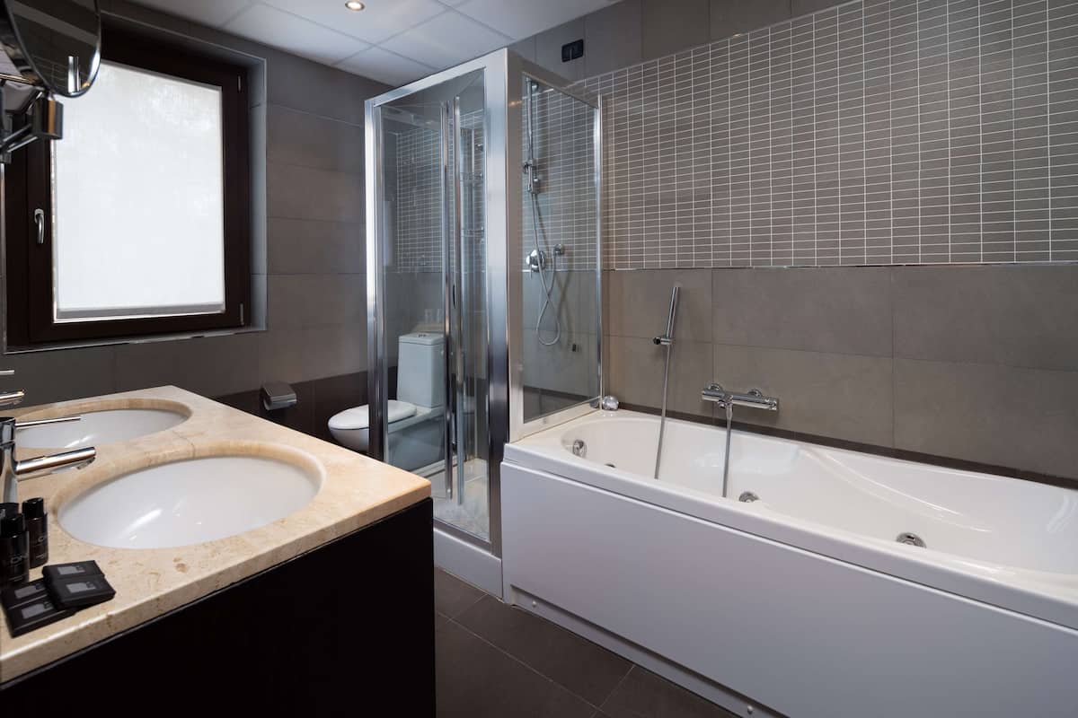 junior suite, 1 king bed (second and third bed is a sofabed) | bathroom | combined shower/bathtub, free toiletries, hair dryer, bidet