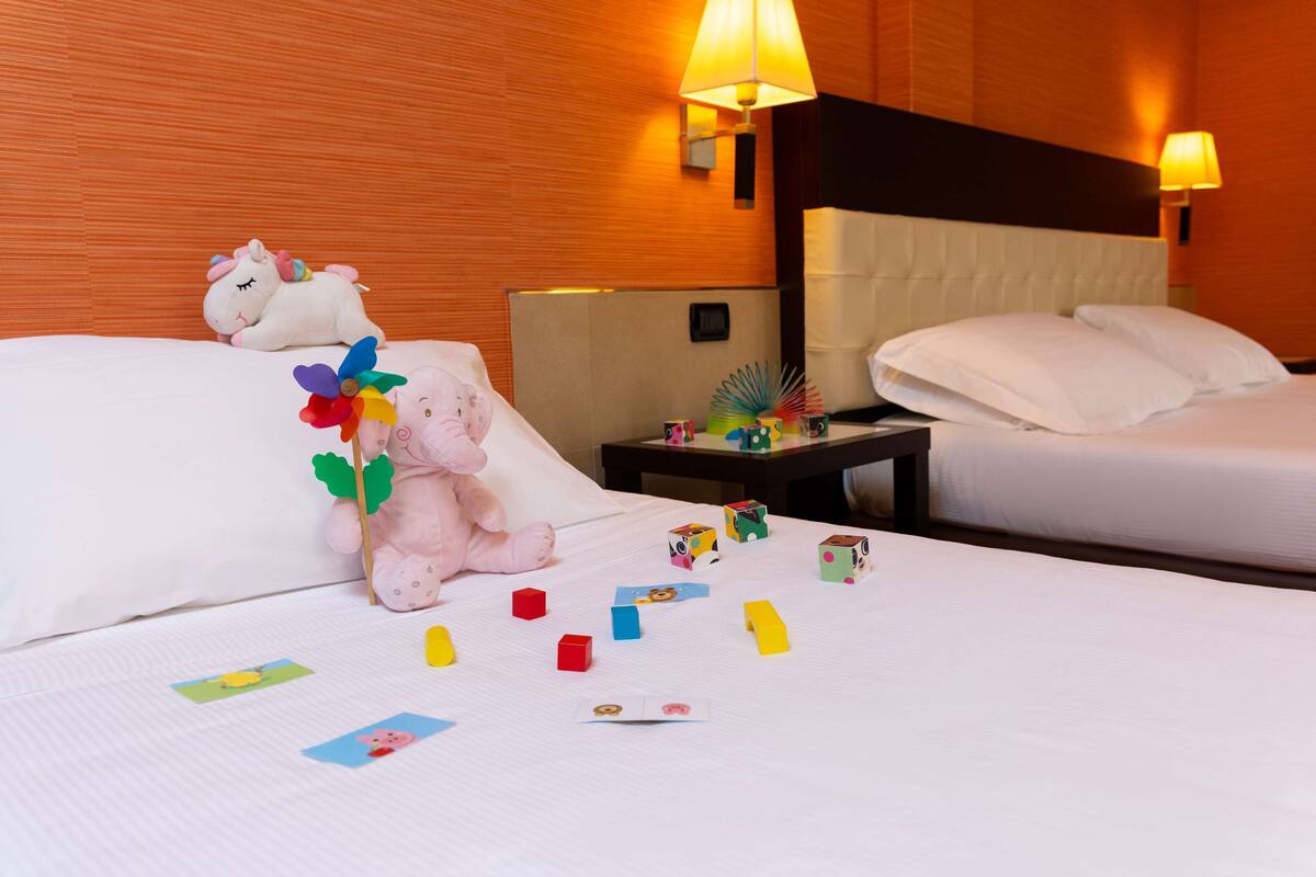 standard room, multiple beds | 1 bedroom, down duvets, minibar, in-room safe