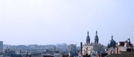 A cityscape with a prominent dome and spires, indicating a historical or religious building.