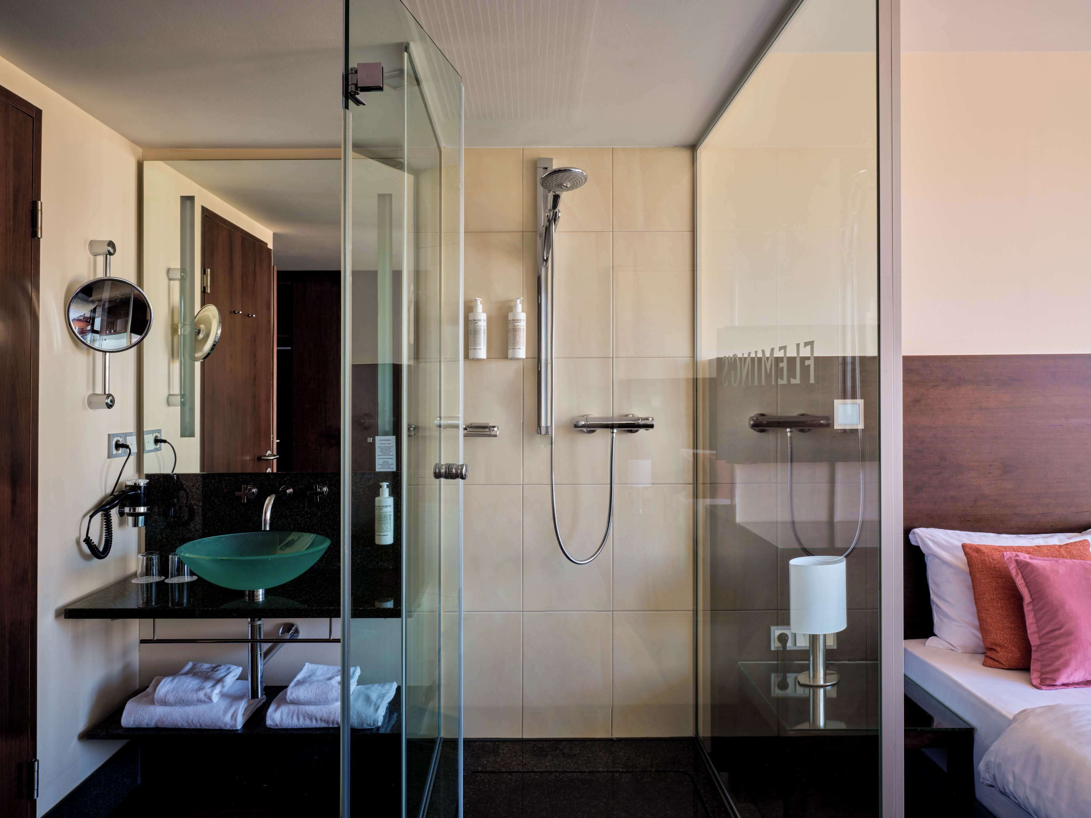 shower, free toiletries, hair dryer, towels