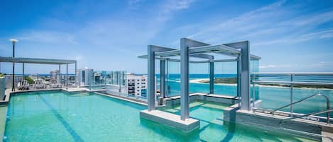 Outdoor pool, pool umbrellas, sun loungers