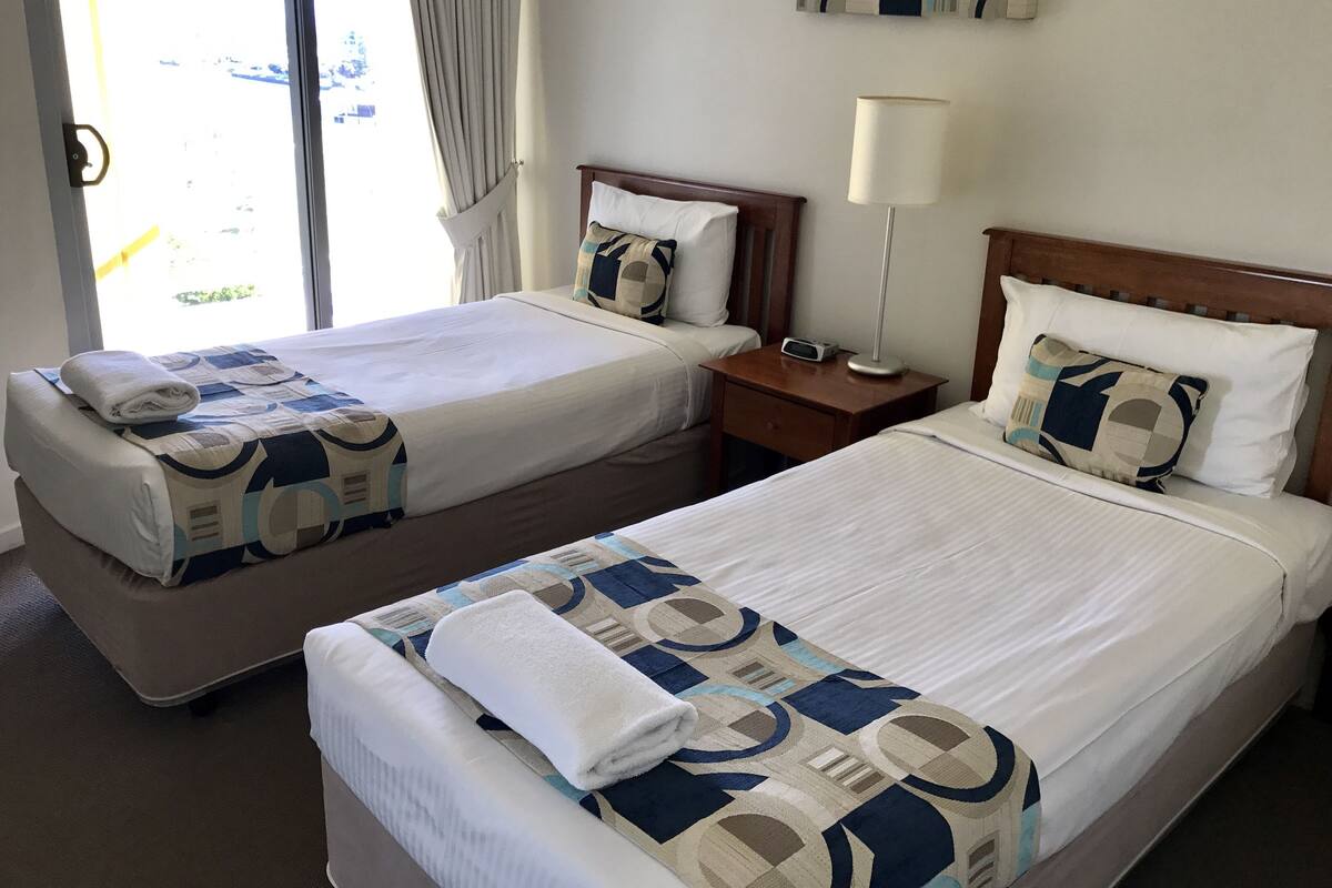 3 Bedroom Partial View  | Desk, blackout drapes, soundproofing, iron/ironing board