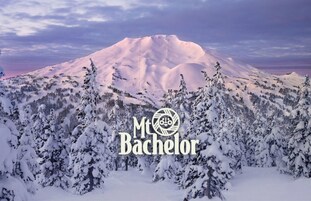 A snow-covered mountain with a logo for "Mt Bachelor".
