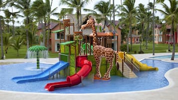 Enjoy thrilling water slides and a refreshing pool surrounded by lush palm trees.
