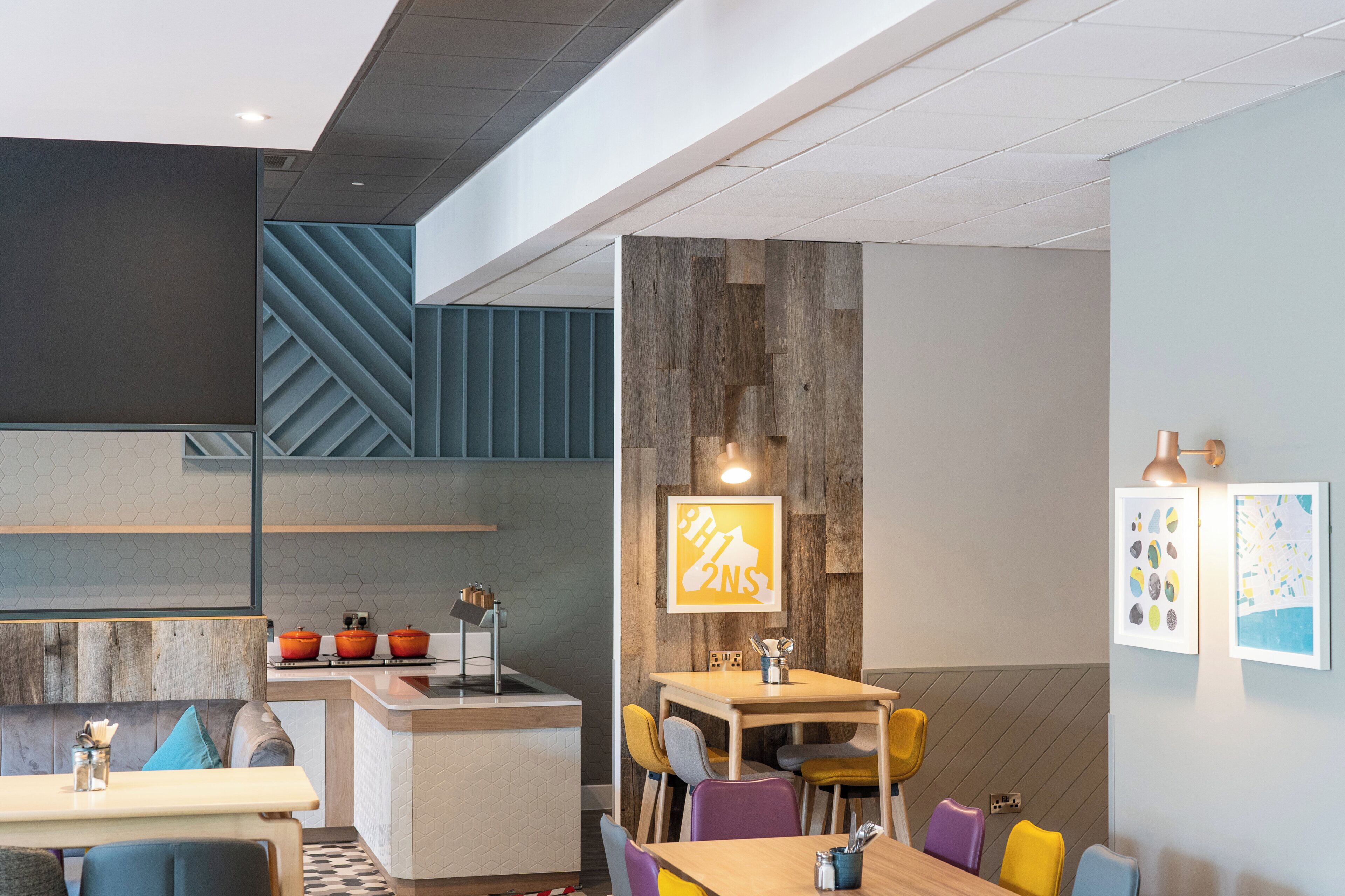 A modern interior with a kitchen, dining area, and seating.