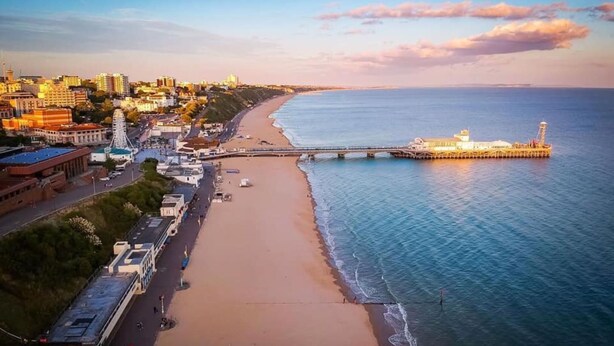 A coastal cityscape with a beach, a pier, and a mix of residential and commercial buildings. - Holiday Inn Bournemouth by IHG (Bournemouth)
