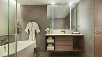 Two Bedroom Signature Suite | Bathroom | Separate tub and shower, hydromassage showerhead, free toiletries