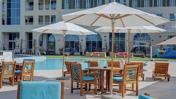 Outdoor pool, open 8:00 AM to 8:00 PM, pool umbrellas, pool loungers