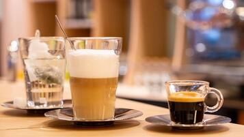 Three beverages on a table with a blurred background.