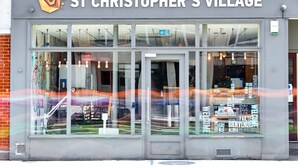 The exterior of St Christopher's Village, featuring a modern storefront with large glass windows and a welcoming entrance. - St Christopher's Village, London Bridge - Hostel (London)