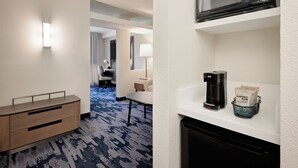 A hotel room with a minibar, a coffee maker, and a microwave. - Fairfield Inn & Suites by Marriott Wilson (Wilson)