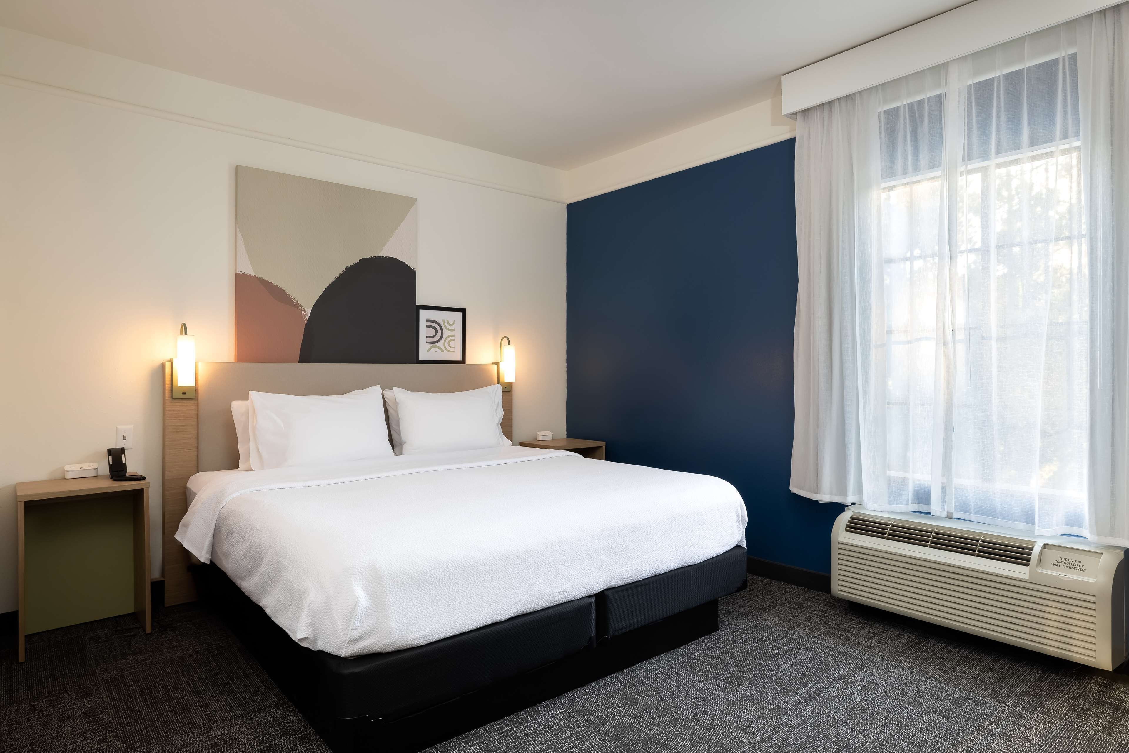 premium bedding, desk, laptop workspace, iron/ironing board