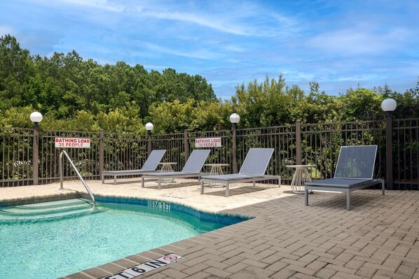 Outdoor pool, open 10:00 AM to 10:00 PM, pool loungers