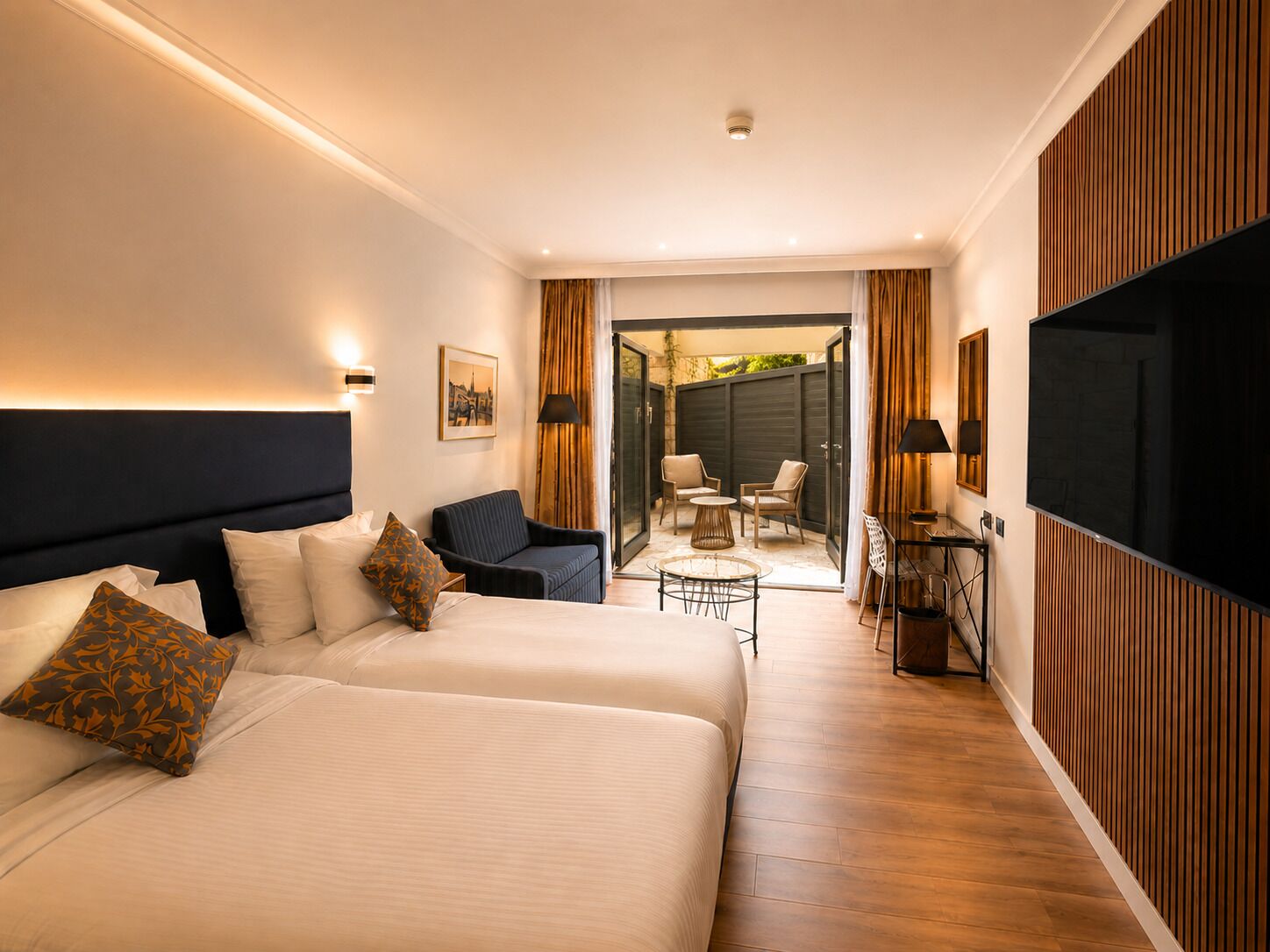 Patio Room | Minibar, in-room safe, iron/ironing board (on request), free WiFi