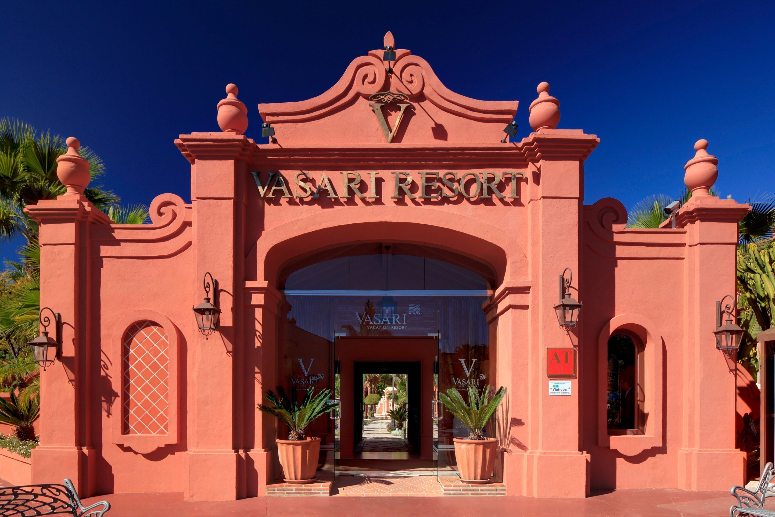 The entrance to Vasari Resort with a prominent archway and a clear view into the interior.