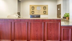 A reception desk with a sign reading "Comfort Inn" and a Dell computer. - Comfort Inn Bolivar (Bolivar)
