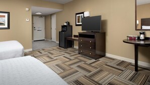 A hotel room with two beds, a television, a coffee maker, and a refrigerator. - Hampton Inn Knoxville East (Knoxville)