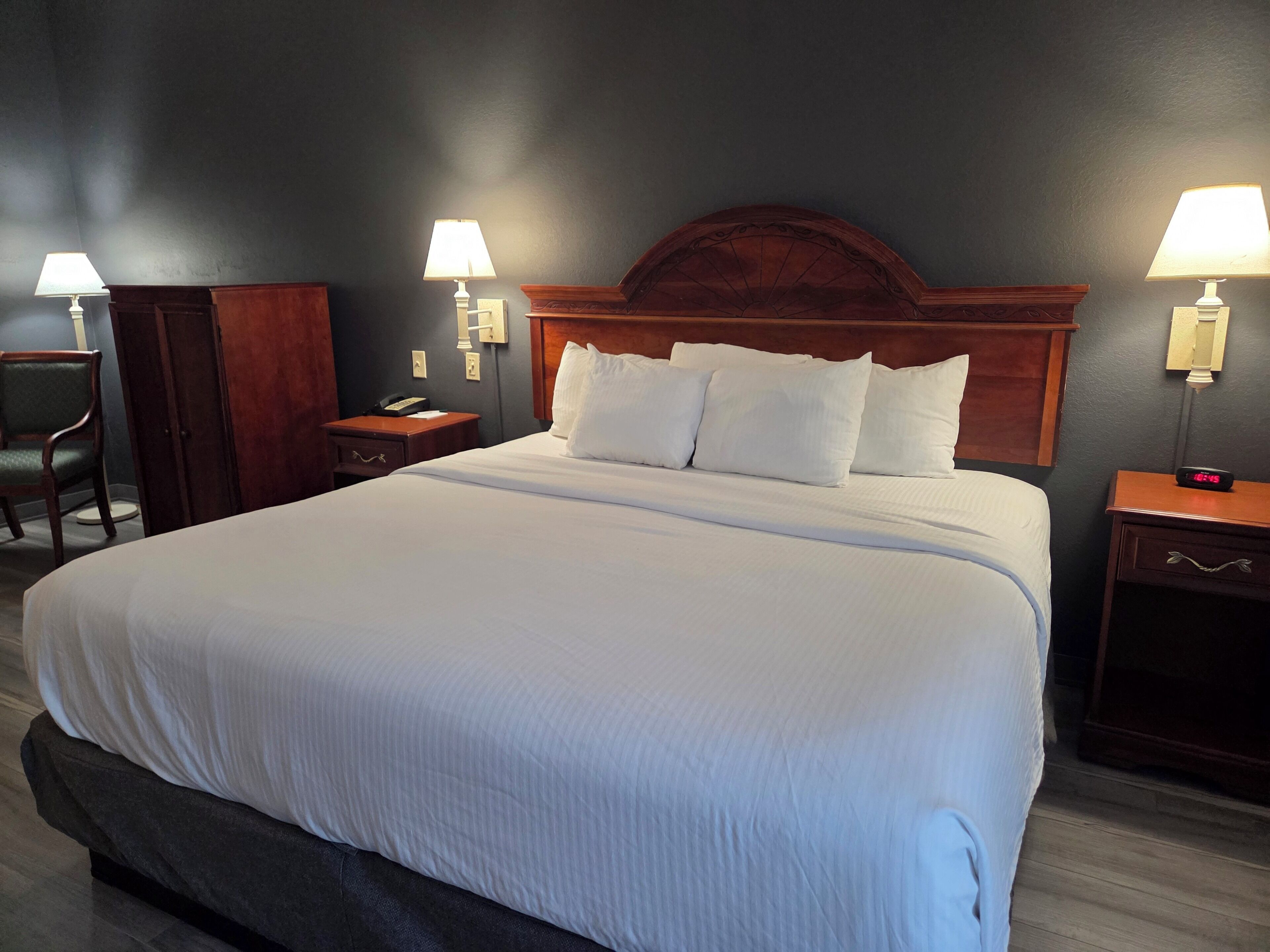 Premium bedding, desk, laptop workspace, blackout curtains