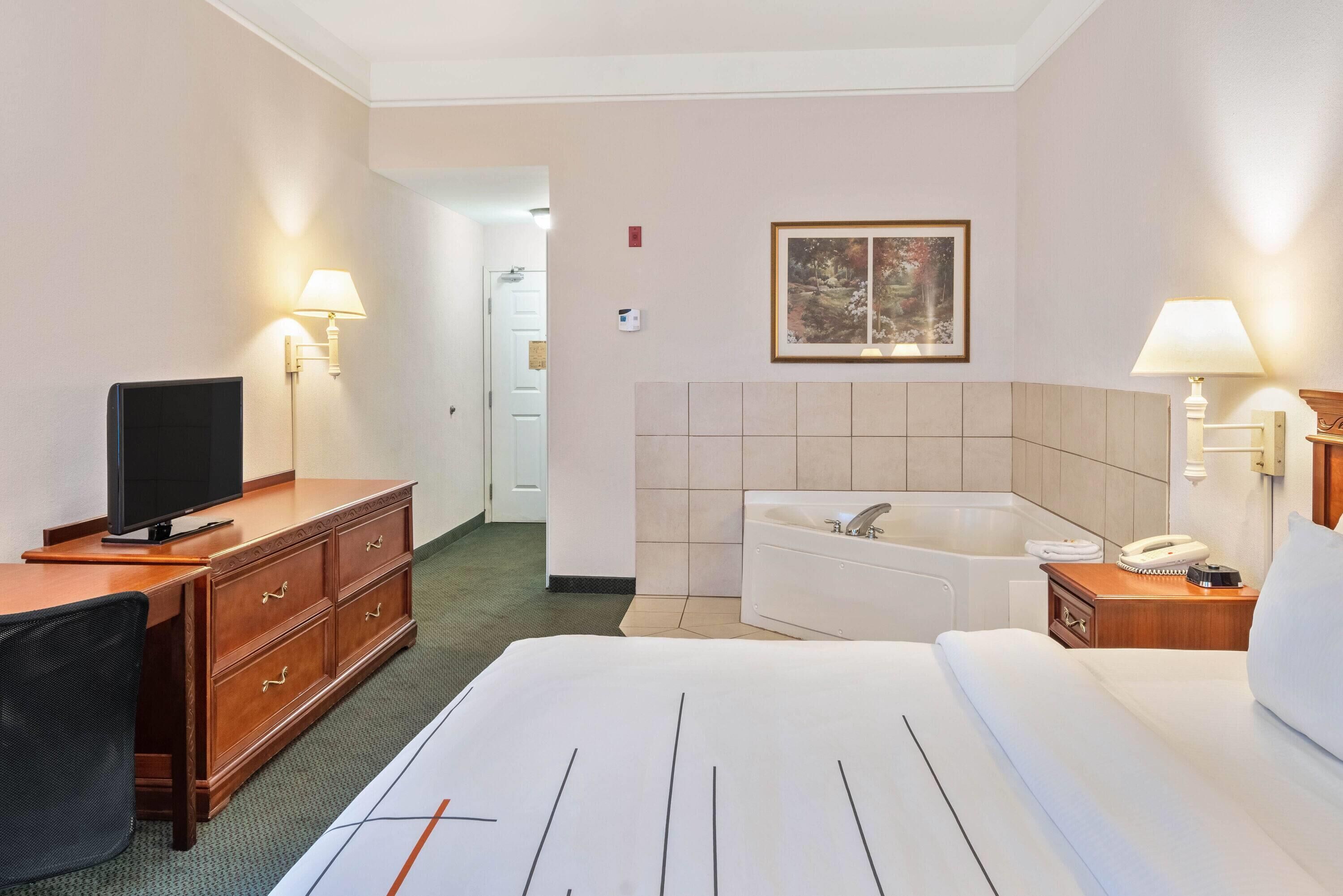 premium bedding, desk, laptop workspace, blackout curtains