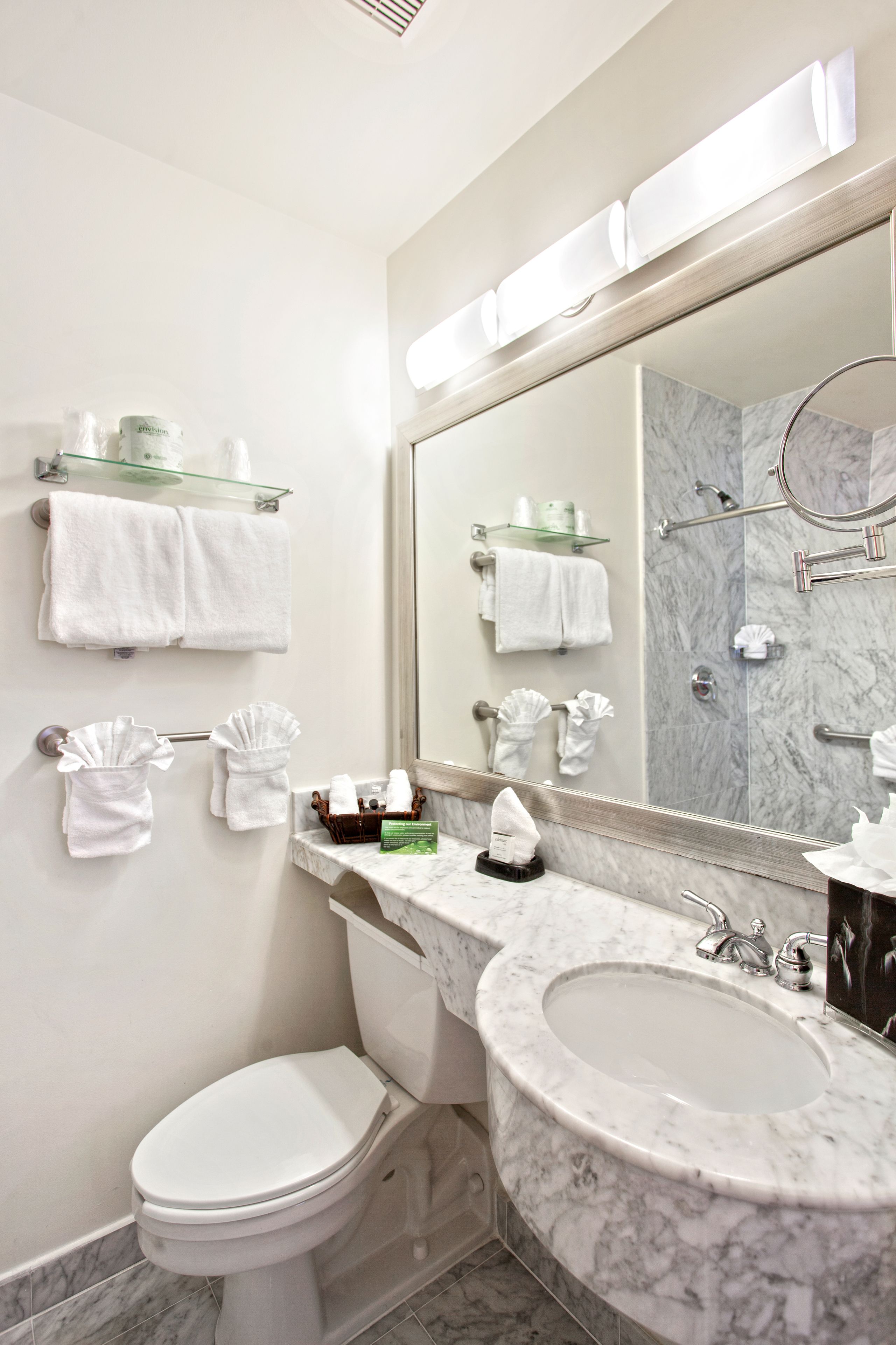 Shower, designer toiletries, hair dryer, towels