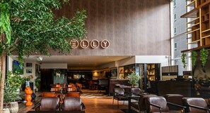 A modern interior with a bar area, seating, and a visible sign with the name 'ELLY'. - Ascott Sathorn Bangkok (Bangkok)