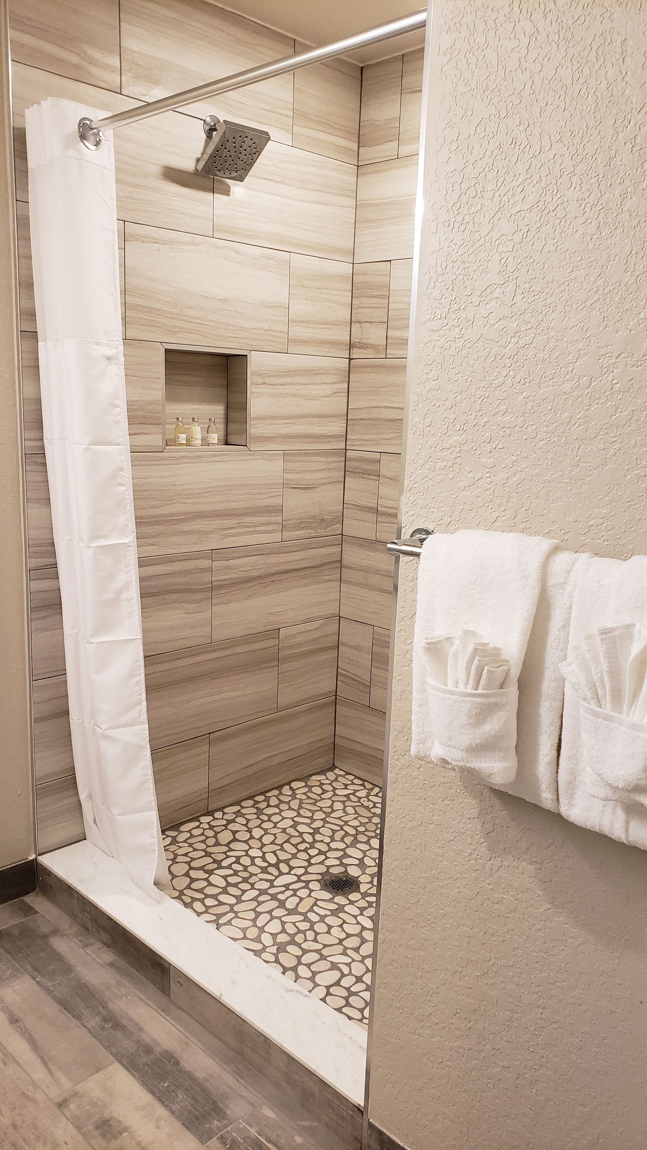 combined shower/bathtub, free toiletries, hair dryer, towels