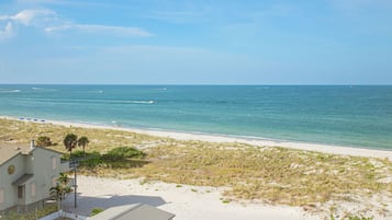 On the beach, white sand, beach cabanas
