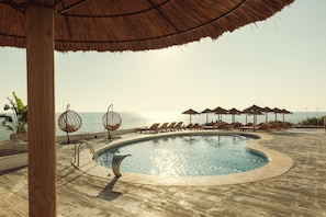 Outdoor pool, open 9 AM to 8 PM, pool umbrellas, pool loungers