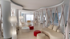 A modern lounge area with a curved ceiling, contemporary furniture, and a view of the outdoors. - Hotel Anba Romani (Sant Llorenc des Cardassar)