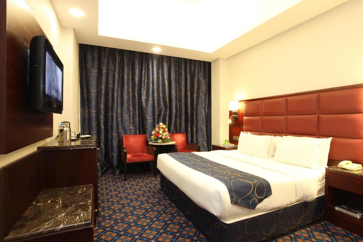 Standard Double Room | Living room | 32-inch TV with satellite channels, DVD player
