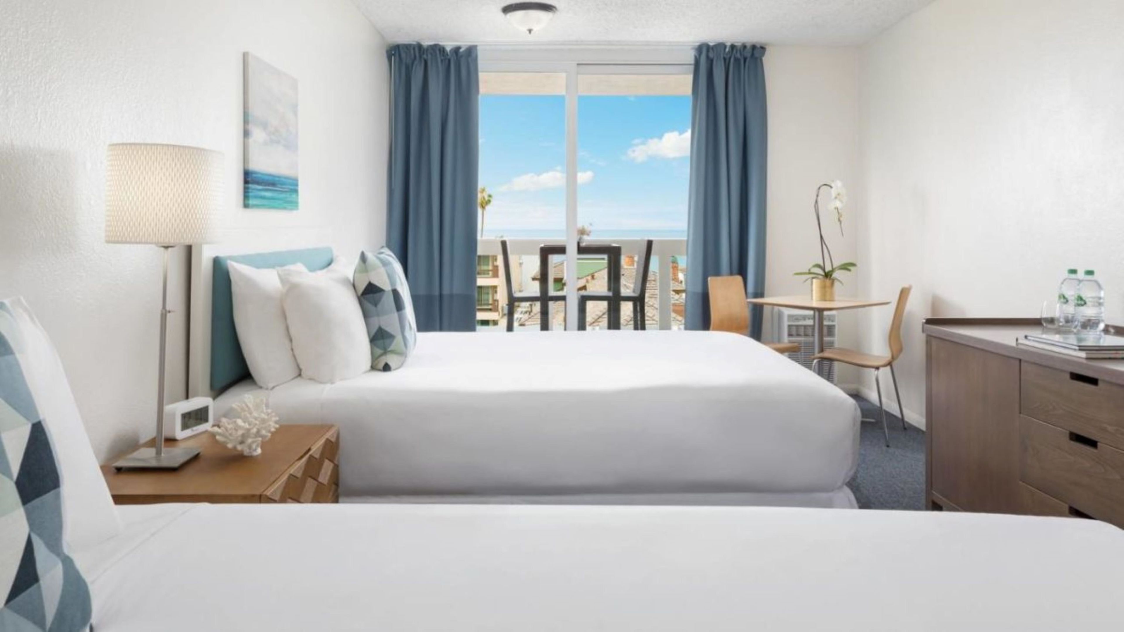 Partial Ocean View Two Double Beds with Balcony | Blackout curtains, iron/ironing board, free cots/infant beds, bed sheets