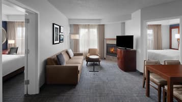 Suite, 2 Bedrooms, Fireplace | Living room | 32-inch flat-screen TV with cable channels, TV, pay movies