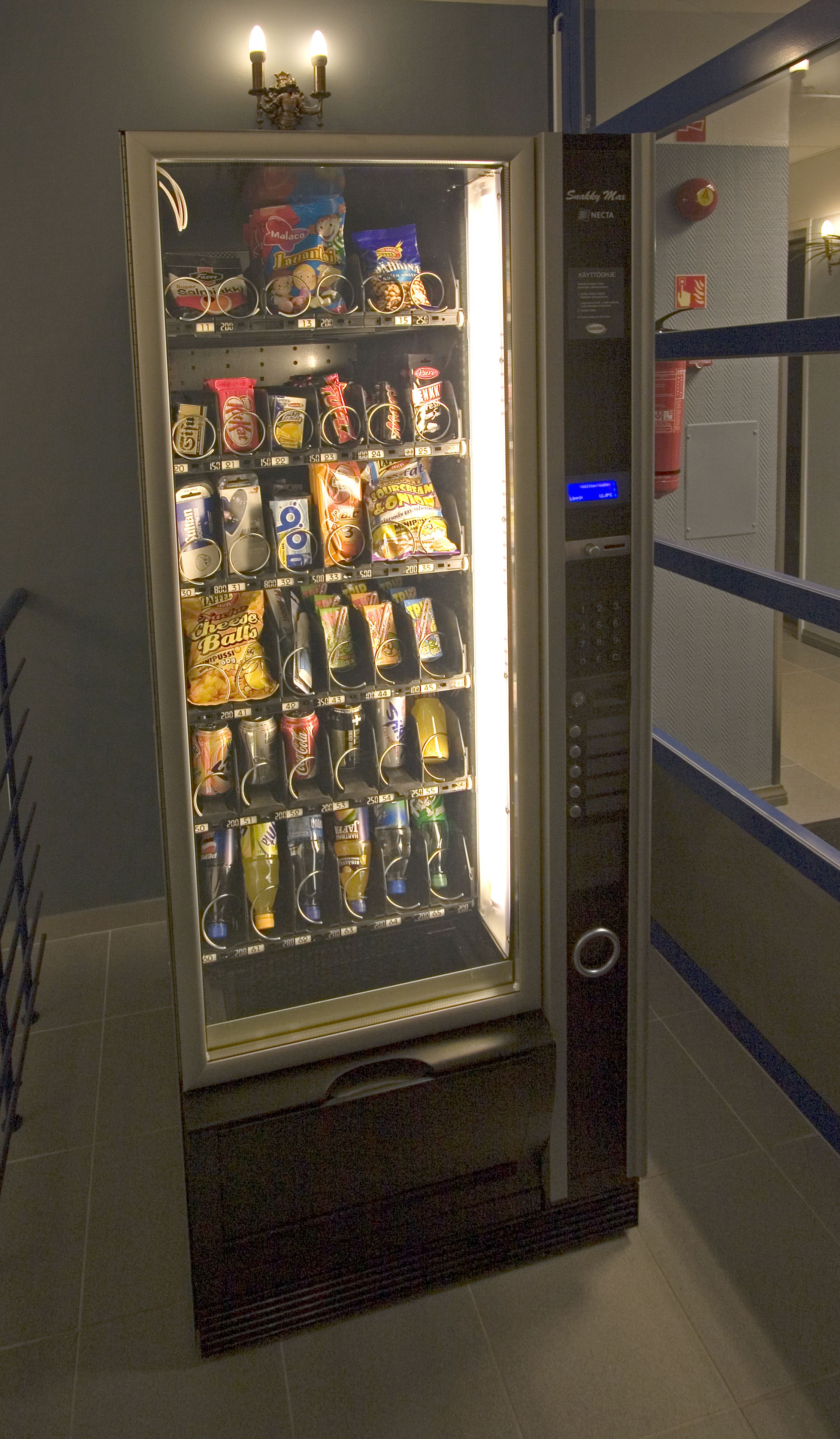 A vending machine with various snacks and drinks.