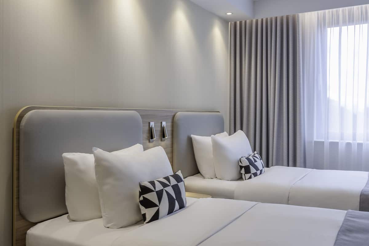 standard room, 2 single beds | in-room safe, desk, iron/ironing board, free cots/infant beds