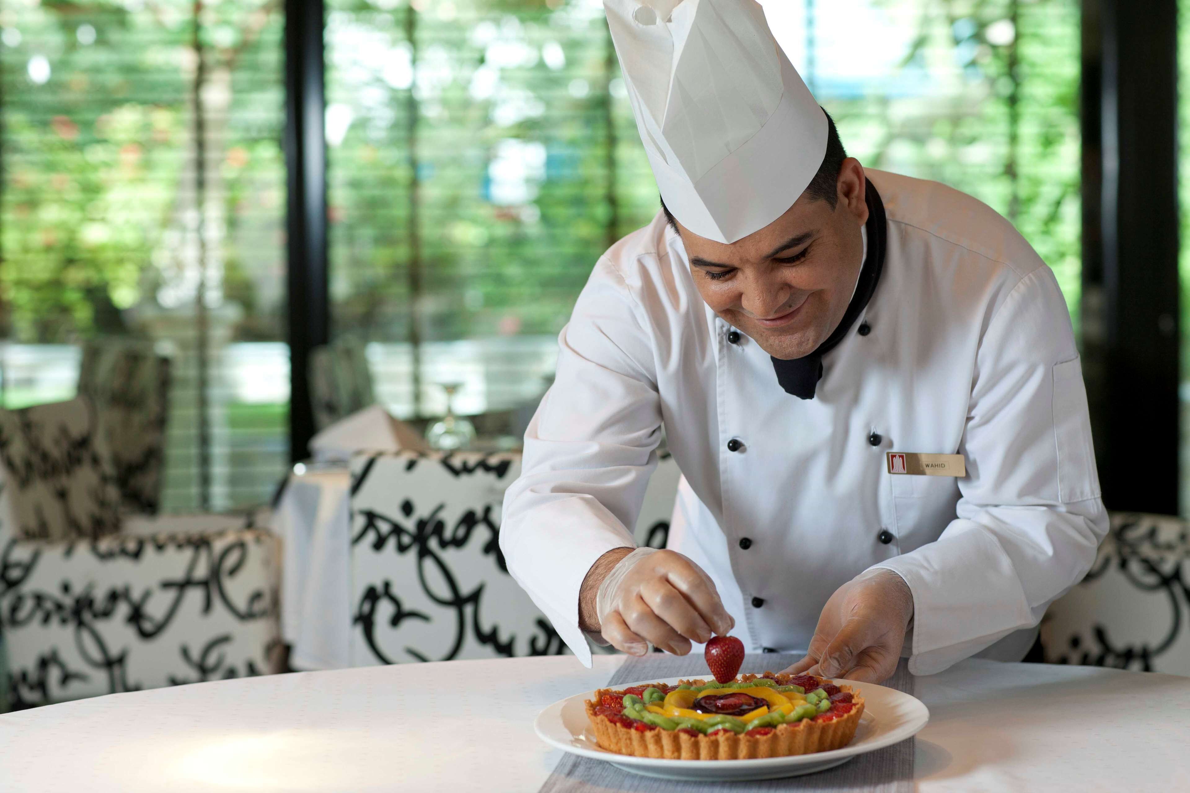 Breakfast, lunch, dinner served; international cuisine, pool views 