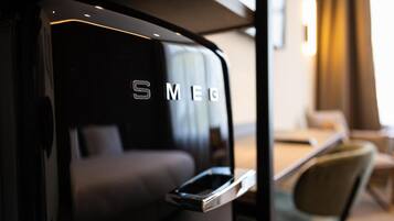 A modern interior with a black wall and a metallic handle.