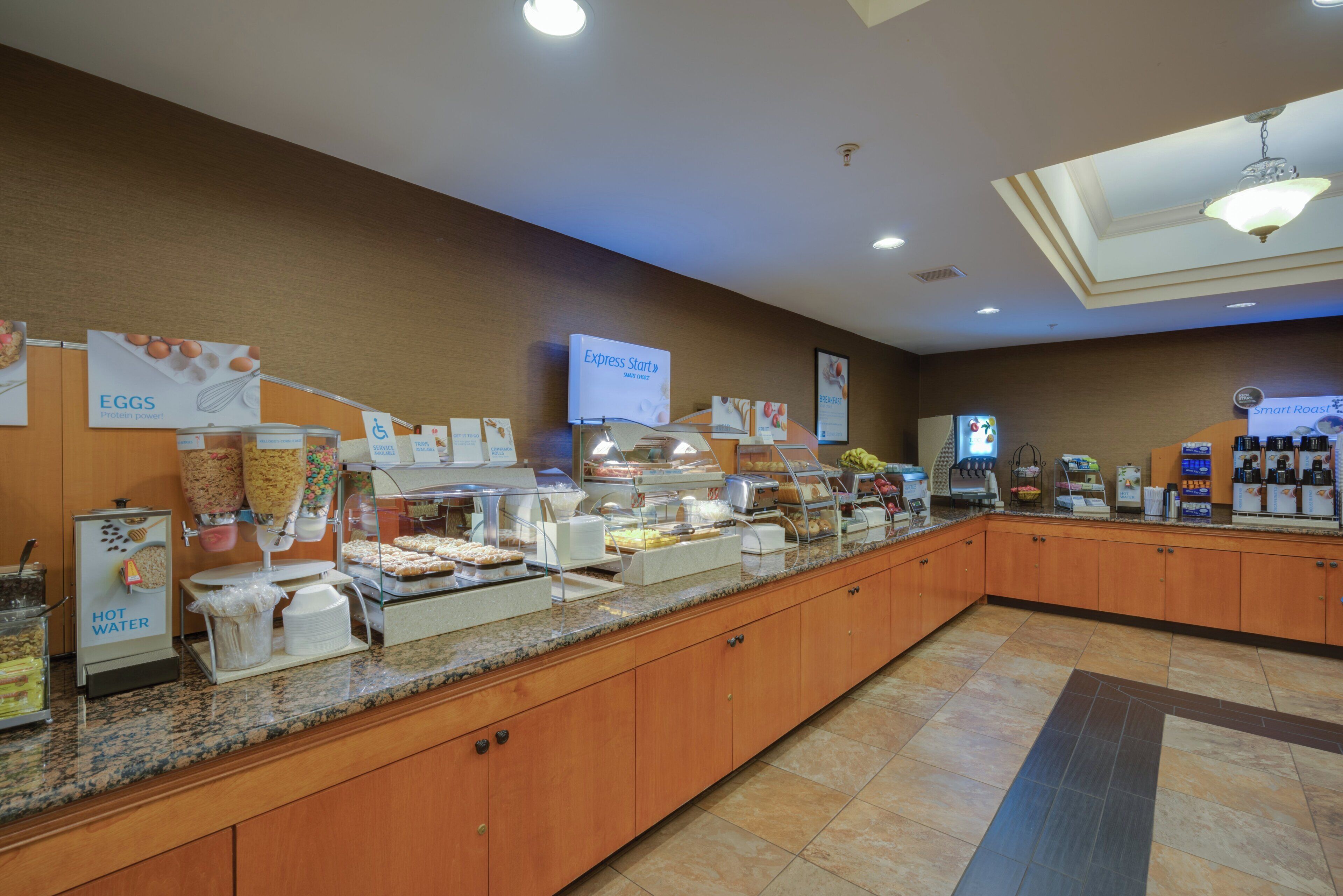 A buffet area with various food options, including a sign for 'Express Start' and 'Smart Roast'.