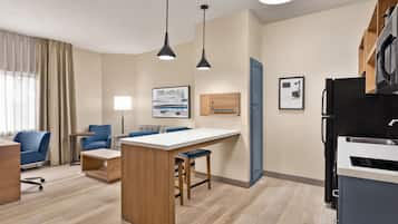 Desk, laptop workspace, blackout drapes, iron/ironing board