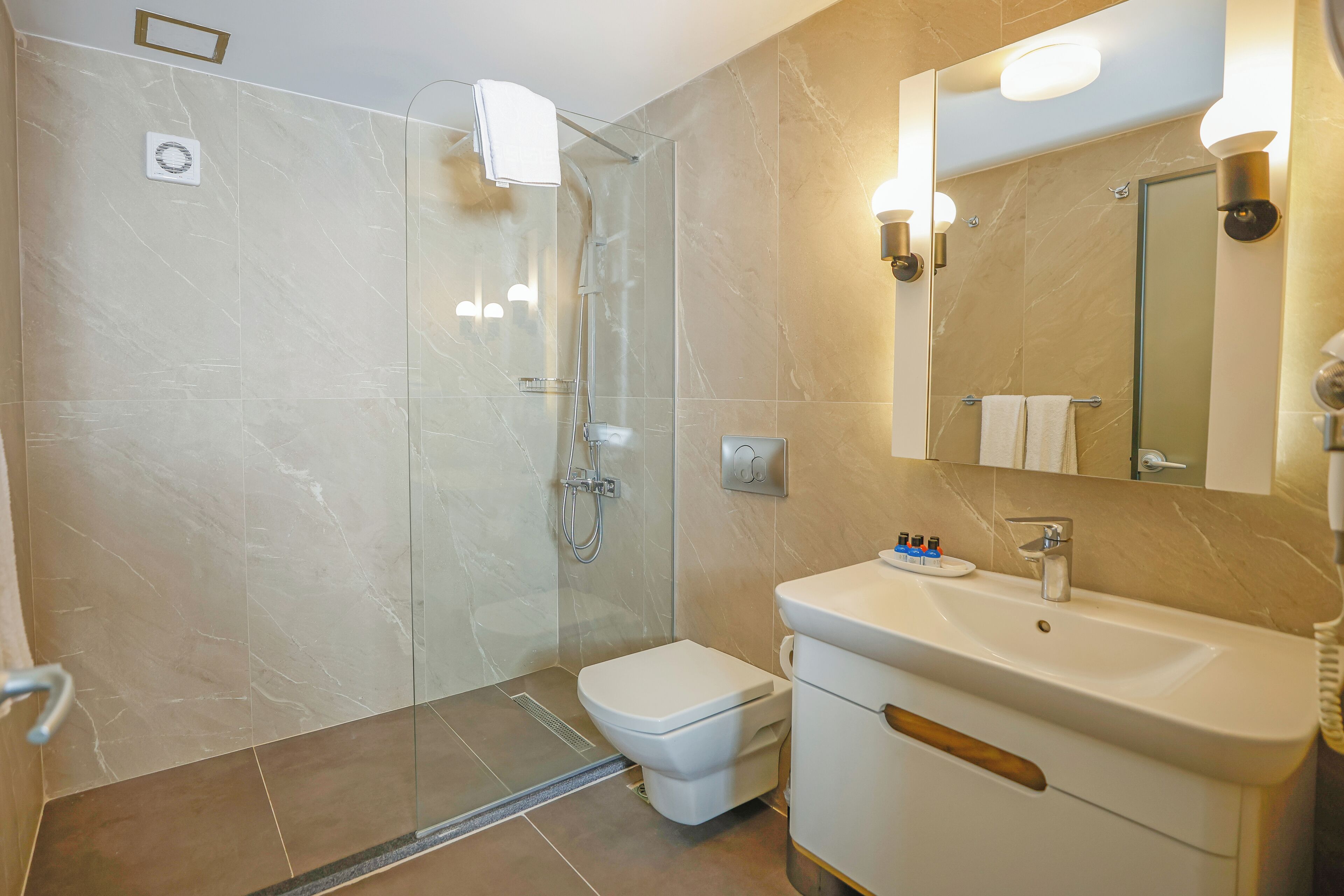 free toiletries, hair dryer, slippers, towels