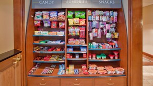 A candy, sundries, and snacks display in a store. - Staybridge Suites Kalamazoo by IHG (Kalamazoo)