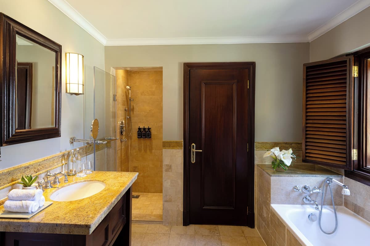 designer toiletries, hair dryer, bathrobes, slippers