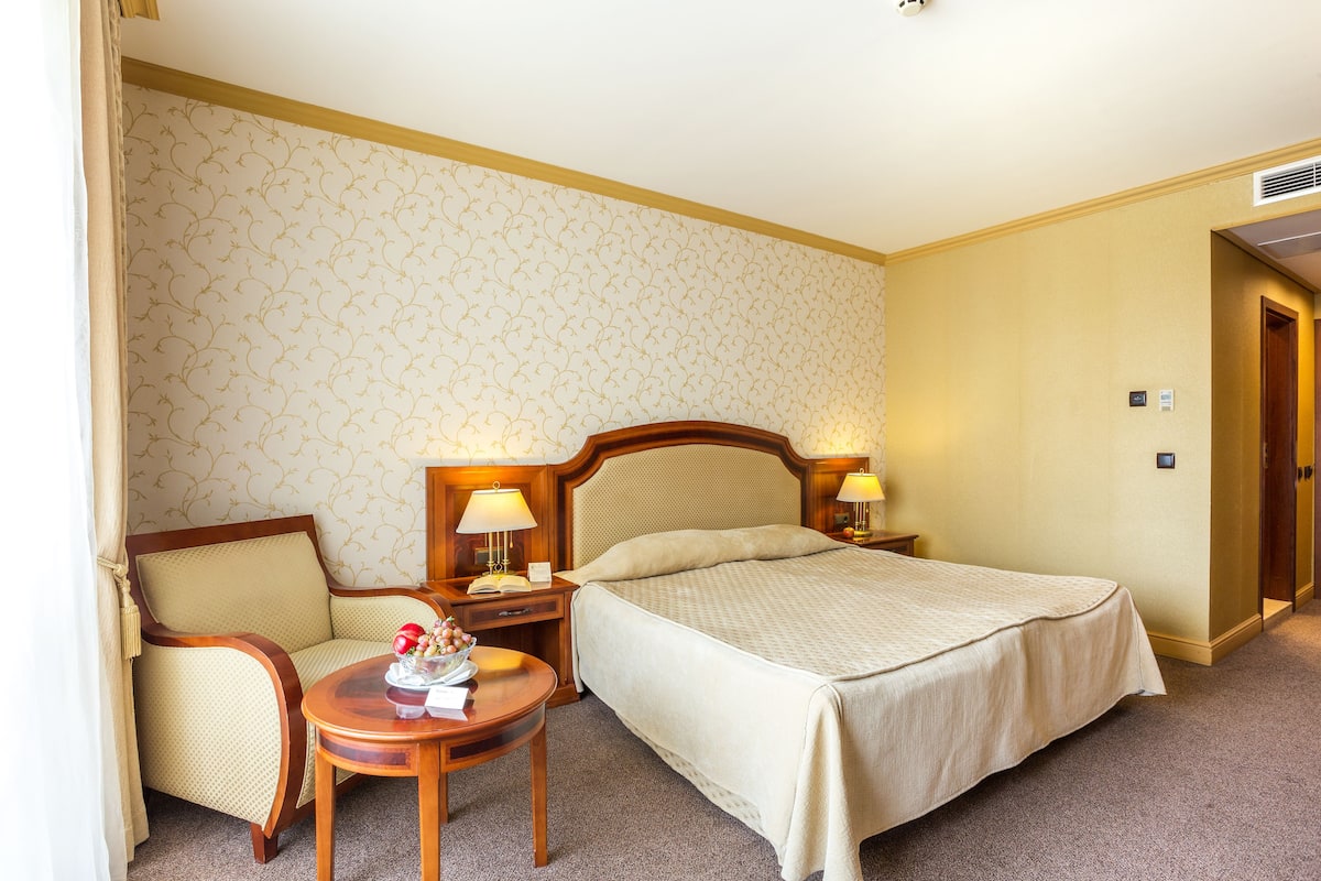 Desk, blackout curtains, bed sheets