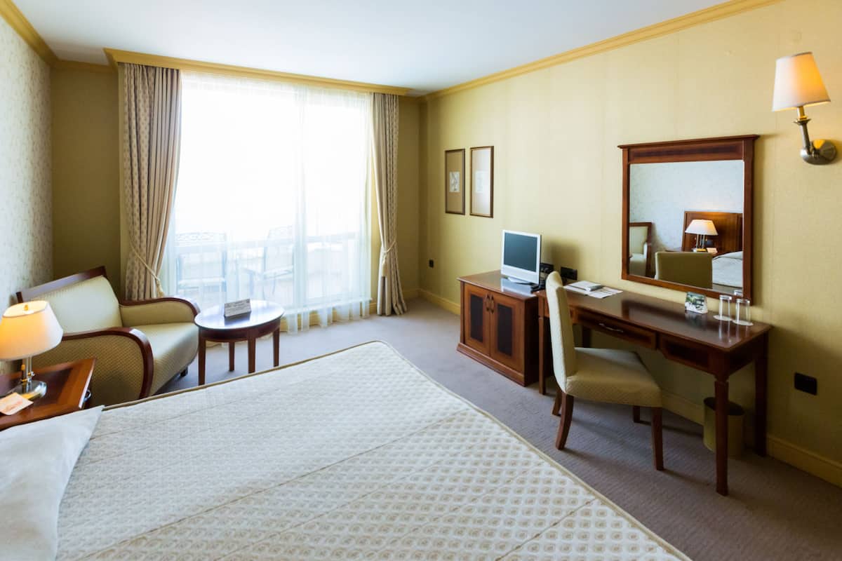 Desk, blackout curtains, bed sheets