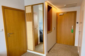 Deluxe Suite, Balcony, Partial Sea View | In-room safe, desk, laptop workspace, blackout drapes