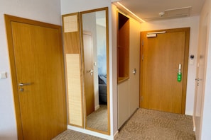 Deluxe Suite, Balcony, Partial Sea View | In-room safe, desk, laptop workspace, blackout drapes