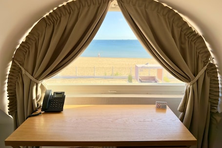 Deluxe Studio Suite, Balcony, Sea View | In-room safe, desk, laptop workspace, blackout drapes