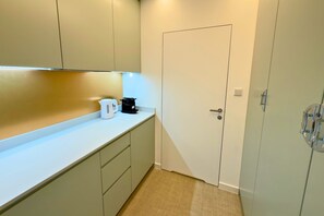 Deluxe Studio Suite, Balcony, Sea View | In-room safe, desk, laptop workspace, blackout drapes
