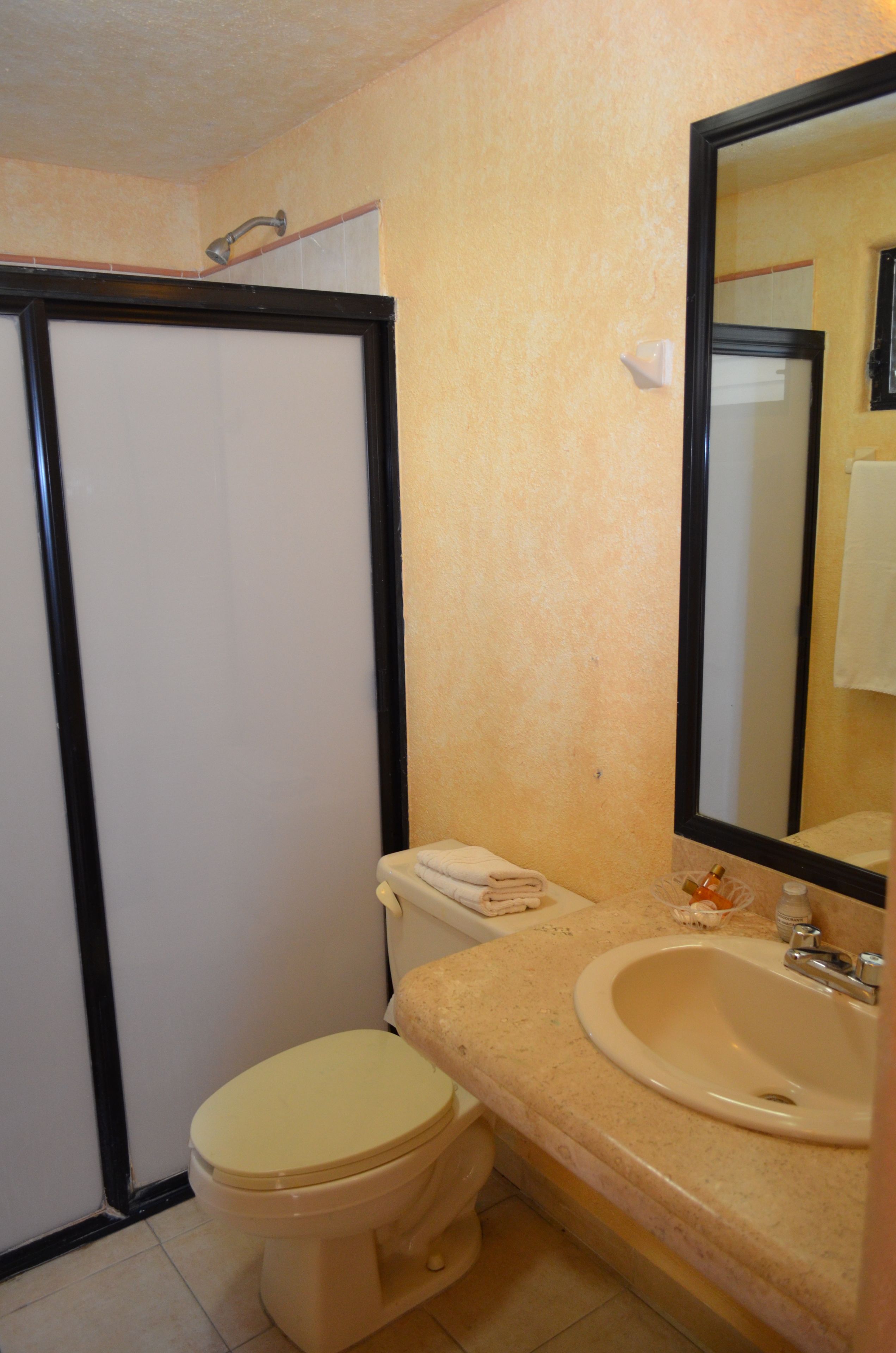 standard quadruple room, 2 double beds | bathroom | shower, hair dryer, towels